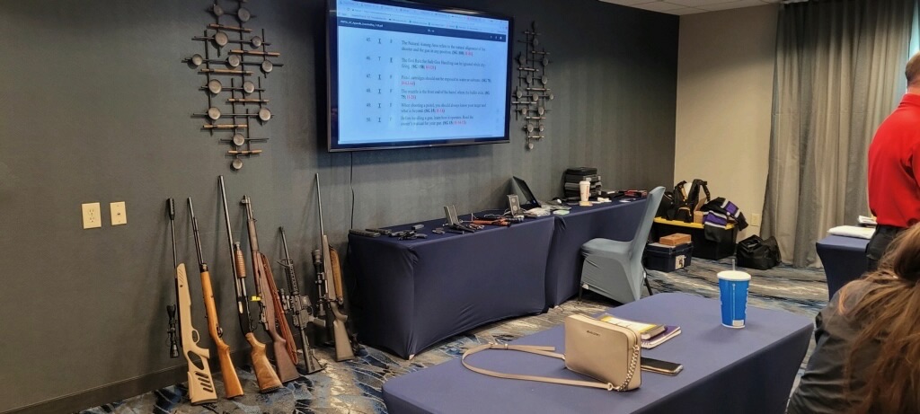 Classroom set up for firearms instruction with training firearms laid out